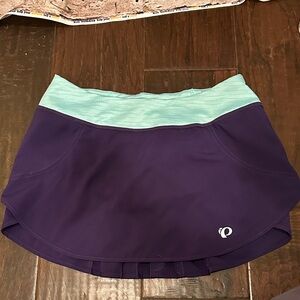 Pearl Izumi Women's Skater Skirt in Purple and Teal